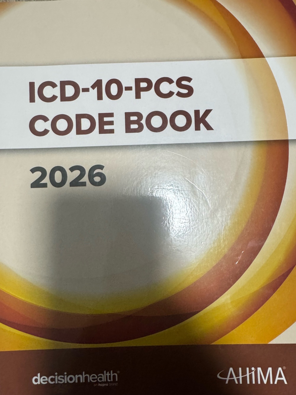AHIMA ICD-10-PCS Code Book 2026 - Yellow & Brown Cover